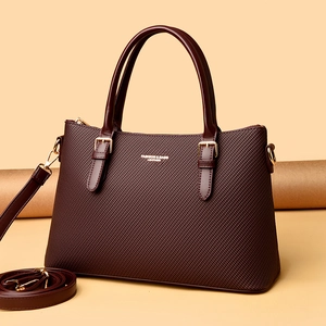 Elegant burgundy leather tote bag with diamond-embossed texture and gold hardware