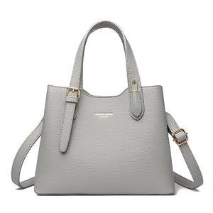Grey vintage tote bag with lychee texture and adjustable shoulder strap on white background