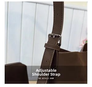 Close-up of adjustable dark brown litchi pattern leather strap with silver metal buckle
