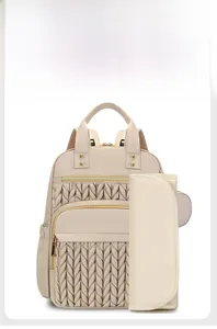 Detail view of the beige diaper backpack with matching foldable changing mat included
