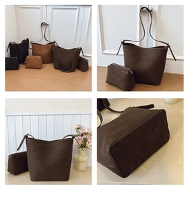 Detail view of suede bucket bag set in black, tan and coffee brown with matching pouches