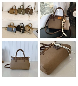 Detail view of canvas bucket bags featuring leather accents and a chocolate pendant charm