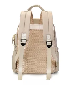 Ergonomic breathable mesh back and padded shoulder straps on beige backpack detail
