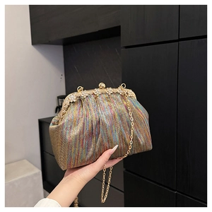 Detail of colorful metallic pleats and rhinestone flower clasp on evening clutch bag