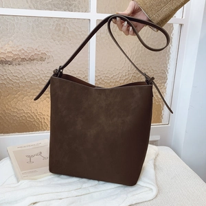 Modern minimalist dark brown frosted leather bucket bag with adjustable strap for women