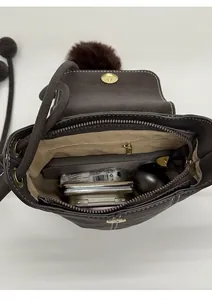 Internal view of brown vintage bucket bag showing capacity for daily essentials