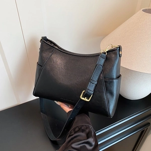 Sleek black hobo shoulder bag with adjustable strap and elegant gold hardware