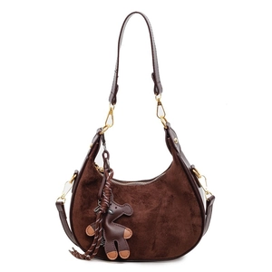 Vintage dark brown suede half-moon bag with bear charm and golden hardware