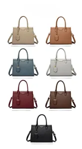 Color display of litchi pattern tote bags in seven shades with metal logo details
