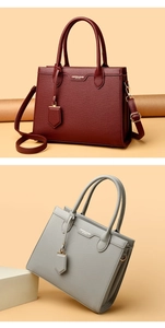 Detailed view of lychee texture handbags in burgundy and grey with detachable straps
