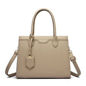 Minimalist khaki litchi grain leather tote bag with gold hardware and shoulder strap