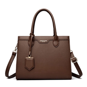 Deep brown litchi pattern leather tote bag with top handles and adjustable shoulder strap