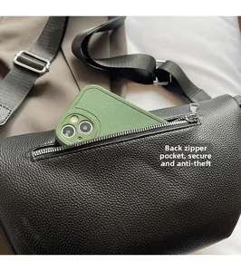 Close-up of secure anti-theft zipper pocket on black lychee pattern leather bag