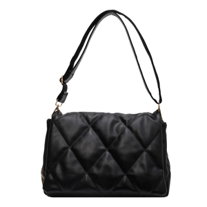 Minimalist black quilted shoulder bag with large diamond stitching and gold hardware