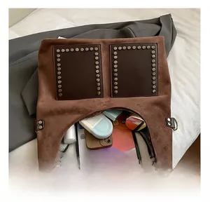 Detail view of large brown suede tote bag with spacious interior for tablet and phone
