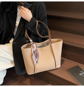 Minimalist beige pebble leather tote bag with silk scarf and slim shoulder straps