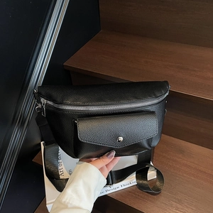 Minimalist black pebble leather waist bag with silver magnetic buckle and wide nylon strap