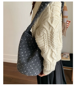Detail of soft charcoal plush tote bag with white polka dots for autumn winter outfits