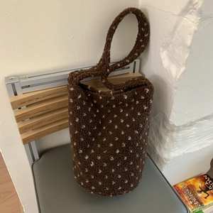 Brown plush bucket bag with white polka dots and long shoulder strap for autumn winter