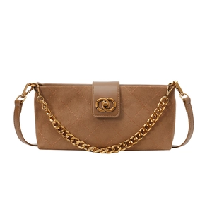 Brown quilted crossbody bag with gold chain strap and ring buckle on white background