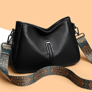 Black litchi grain leather tote bag with colorful ethnic style wide shoulder strap