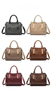 Selection of woven texture boston bags in six colors with leather handles and straps