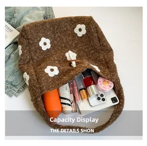 Capacity display of the brown plush tote bag with white flower patterns and toggle button