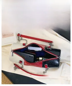 Detail view of the large capacity interior of the tri-color cylinder chain bag for women