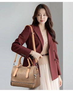 Brown woven texture tote bag with leather handles shown in a professional commute style