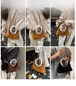 Detailed views of plush faux shearling handbags in camel, brown, and black colors