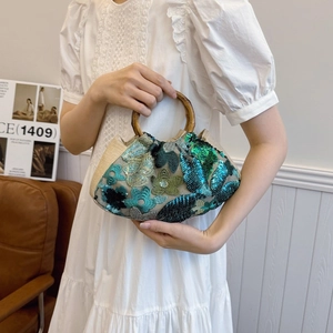 Bohemian style bamboo handle handbag with sequin floral embroidery on woven fabric
