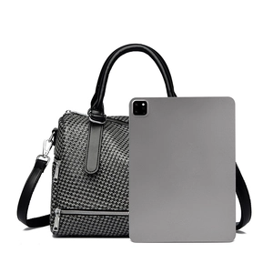 Boston bag size comparison next to a tablet showing the spacious woven texture design