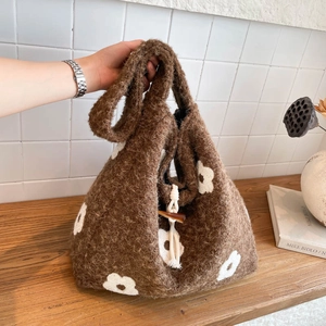 Brown fuzzy knit shoulder bag with white flower pattern and vintage horn toggle closure