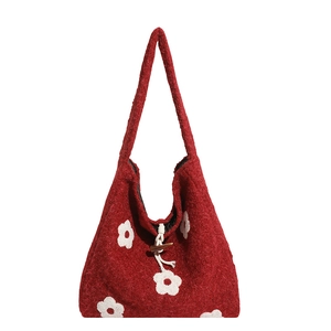 Red wool felt tote bag with daisy floral pattern and vintage wooden toggle closure