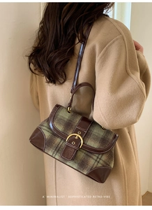 Retro plaid handbag with green wool and brown leather detail on camel coat model