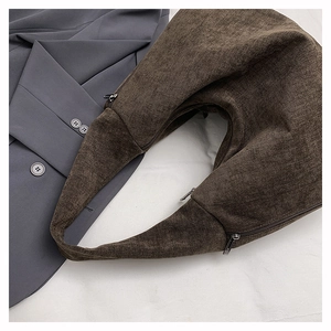 Detailed top view of a dark coffee canvas hobo bag with durable metal zippers