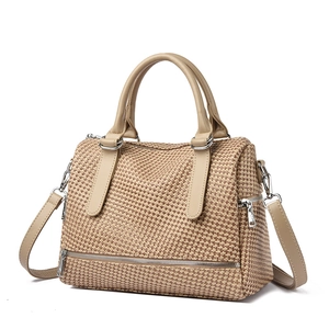 Minimalist beige woven Boston bag with leather handles and crossbody strap