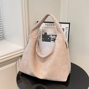 Minimalist beige canvas hobo shoulder bag with large capacity and textured finish