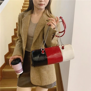 Minimalist tricolor cylinder shoulder bag with silver chain and red strap in chic style