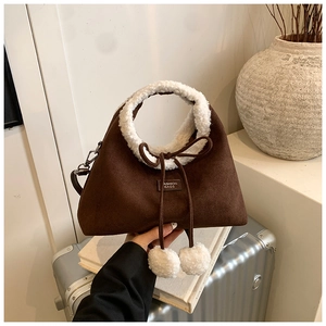 Chic brown suede and white fleece handbag with plush pom-poms for autumn winter style