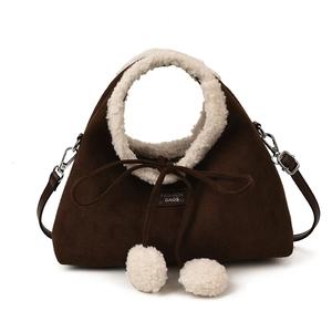 Brown faux suede handbag with plush lamb wool trim and decorative cute pom-poms
