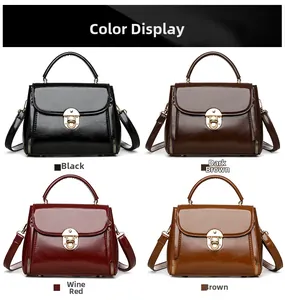 Color display of shiny leather handbags with gold clasps in black, brown, and wine red