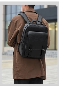 Close-up of black leather backpack with buckle detail and padded straps for daily commute