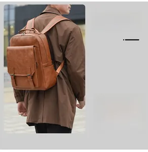 Brown leather backpack for men showing outdoor travel usage with metal buckle detail