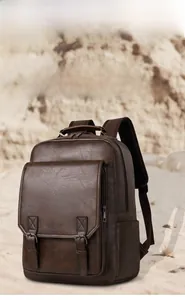 Detailed close-up of brown vintage leather backpack texture and front flap buckle