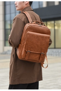 Brown vintage faux leather backpack featuring a front flap pocket and dual buckles details