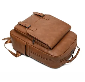 Detail of vintage brown leather backpack with buckle flap and textured PU surface