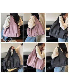Detail shots of large nylon tote bags in pink and charcoal with side pockets and ruching