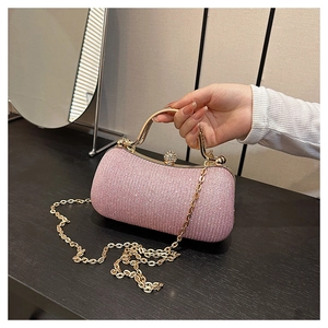 Pink rhinestone evening bag with gold metal frame and sparkling clasp detail