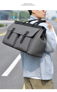 Outdoor macro shot of waterproof nylon travel bag with dual pockets and buckle closures